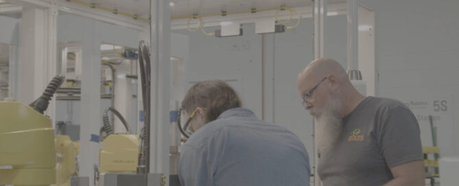Jim and Paul talking in training.